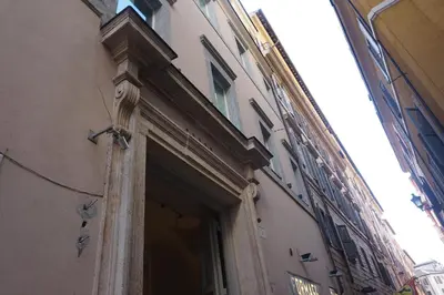 a building with a doorway in a city at Trevi Palace Luxury Inn in Rome