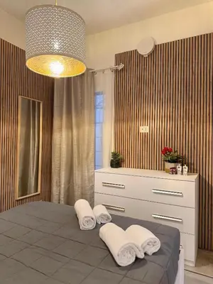 a bedroom with a bed with towels on it at Leonina 75 Holidays in Rome