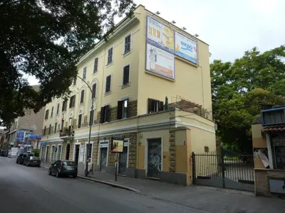 a yellow building on the side of a street at Casa ParticulART in Rome