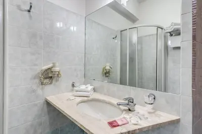 a bathroom with a sink and a mirror at Guest House Masterintrastevere in Rome