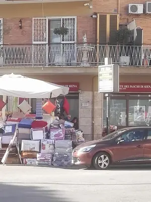 a car parked in front of a store with a pile of furniture at B&B Destinazione Roma in Rome
