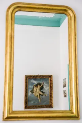 a framed painting of a woman riding a horse at Guesthouse Serafino in Rome