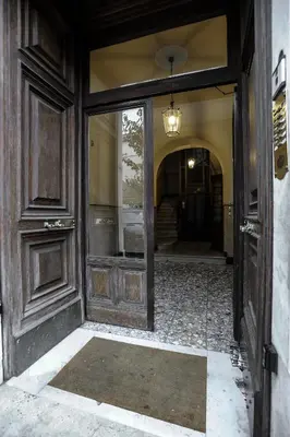 an entry to a house with a door and a hallway at Guesthouse Serafino in Rome
