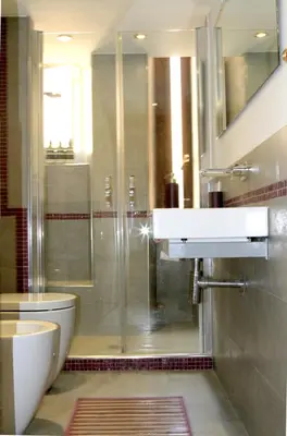 a bathroom with a shower and a toilet and a sink at MANDRUCHELLO'S in Rome