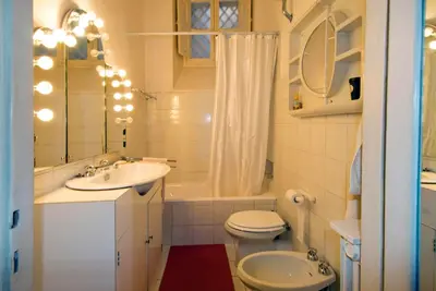 a bathroom with a sink and a toilet and a bath tub at Il Mio Giardino in Rome