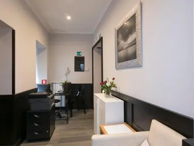 a living room with a couch and a table at DK Suites in Rome