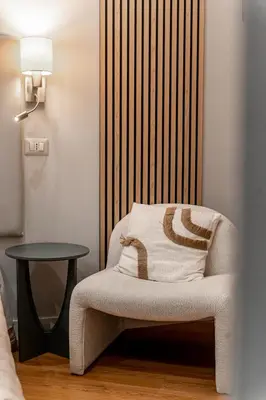 a room with a table and chairs and a room with a shelf at Domus Domas & Boutique - Golden Keys Collection in Rome