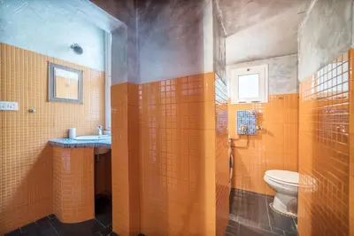 a bathroom with a toilet and a sink at Quirinale Apartments in Rome