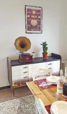 a dining room with a table and a dresser at BigFamilyRome - San Giovanni Basilica in Rome