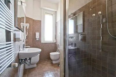 a bathroom with a sink and a toilet and a shower at BigFamilyRome - San Giovanni Basilica in Rome