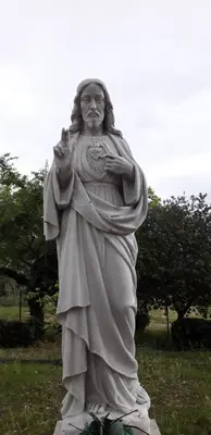 a statue of a man standing in a field at Ostello Villa Monte Mario in Rome