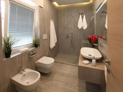 a bathroom with a toilet and a sink and a shower at Appartamento Turistico Laura in Rome