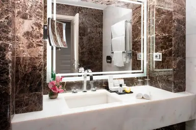 a bathroom with a sink and a mirror at The First Arte - Preferred Hotels & Resorts in Rome