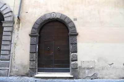 a wooden door on the side of a building at Suite 21 - Piazza Navona in Rome