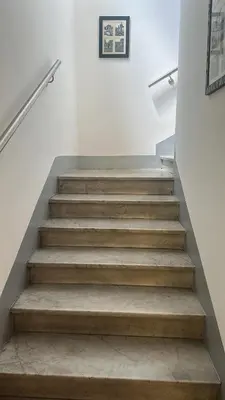 a set of stairs in a house at All Comfort Astoria Palace in Rome