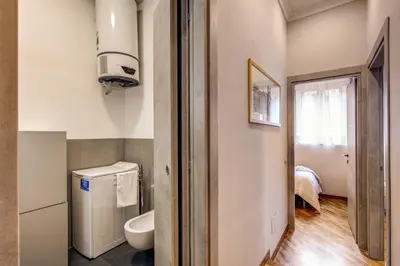 a small bathroom with a toilet and a sink at Appartamento via del Pantheon in Rome