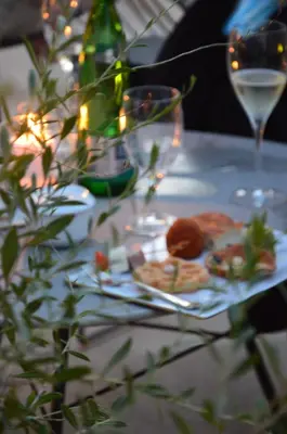a table with a plate of food and glasses of wine at Hotel Royal Bissolati in Rome