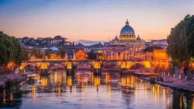 a view of the vatican city at night at Monserrato Apartment in Rome