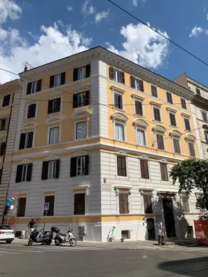 a large building with two motorcycles parked in front of it at In the Center by Local Domus in Rome
