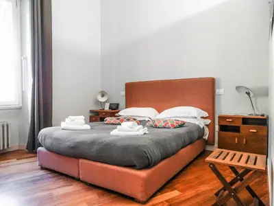 a bedroom with a bed with two towels on it at Mecenate Rooms in Rome