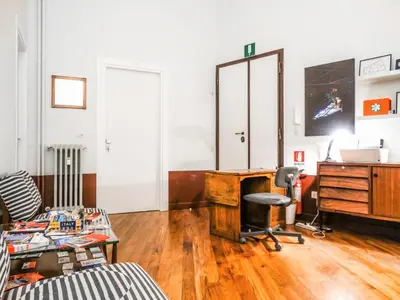 an office with a desk and a chair at Mecenate Rooms in Rome