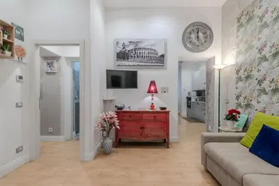 a living room with a couch and a table with a lamp at Casa Fabio in Rome