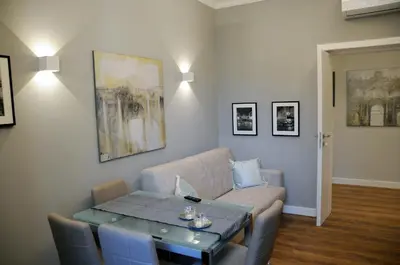 a living room with a couch and a table at Nomentana House in Rome