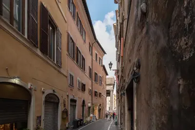 an empty street in an alley between two buildings at GuestHost - Pantheon Charming Apartment in Rome