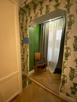 a bedroom with a bed and a desk and a suitcase at Boutique Hotel Anahi in Rome