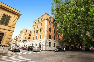 a tall building on the side of a city street at ilPlatano-Testaccio in Rome