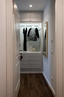 a walk in closet with a dresser and a mirror at Eighty Four Rooms in Rome