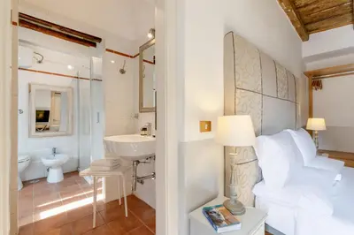 a bathroom with a sink and a toilet at The Bluehostel in Rome