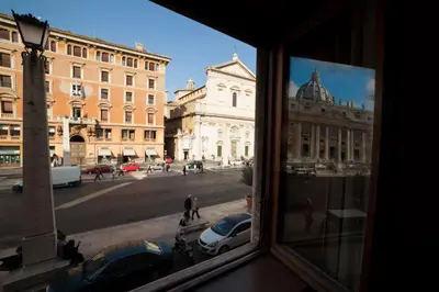a view of a city street from a window at St. Peter' Six Rooms & Suites in Rome