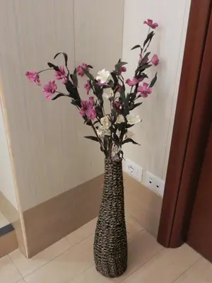 a vase with pink and white flowers in it at Meraviglia in Rome