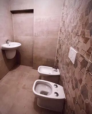 a bathroom with a toilet and a sink at Melting Pot Rome in Rome