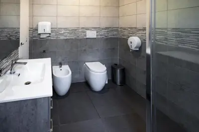 a bathroom with a sink and a toilet and a shower at Melting Pot Rome in Rome