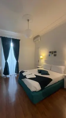 a bedroom with a large bed in a room at Suitedream Vatican in Rome