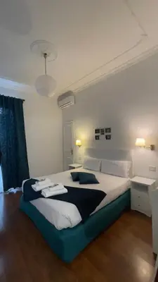 a bedroom with a large bed in a room at Suitedream Vatican in Rome