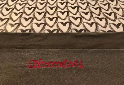 a close up of a blanket with hearts on it at Appart. delizioso nel centro di Roma Vaticano in Rome