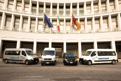 a group of vehicles parked in front of a building at Bed & Breakfast Armonie Romane in Rome