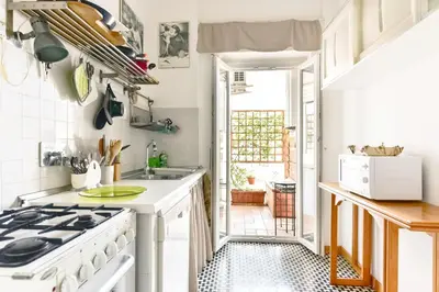 a kitchen with a stove and a sink at La Canterina al Vaticano in Rome