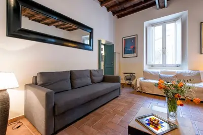 a living room with a couch and a table at Domus Florea in Rome
