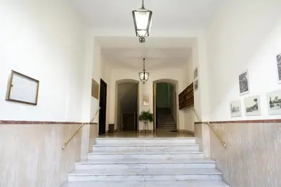 a hallway with stairs in a building at The Dream Of Colosseum in Rome