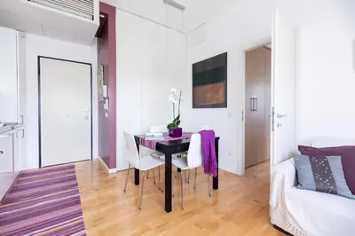 a living room with a table and a couch at Lambertone, cozy flat in Rome, Aurelio Vatican in Rome