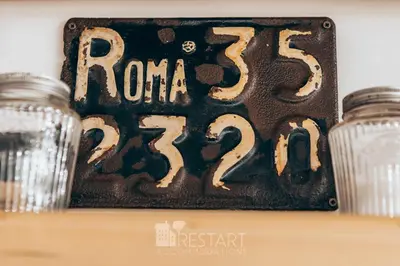 a sign that says roma sitting on a table at Restart Accommodations Balestra in Rome