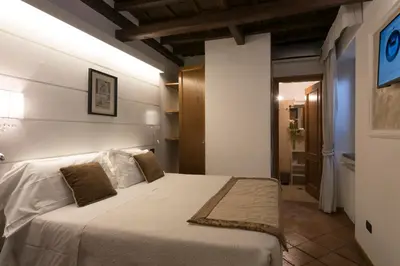 a bedroom with a large bed in a room at JR Suites in Rome