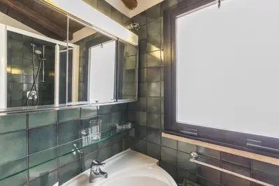 a bathroom with a sink and a window at Monti Stairway to Heaven in Rome