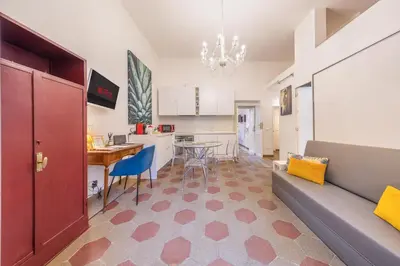 a living room with a couch and a table at La Vaticana - Saint Peters View - Apt Rome in Rome