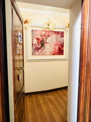 a door leading into a room with a painting on the wall at Termini station holidays in Rome