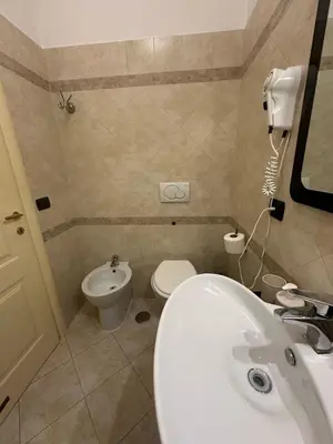 a bathroom with a sink and a toilet at Termini station holidays in Rome